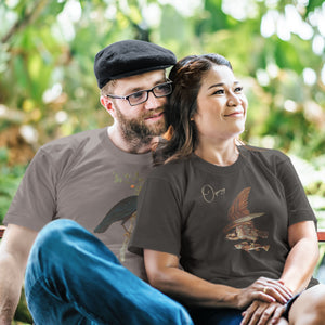 Black bird shirt with vintage art of an osprey with a fish in its talons and the word "Osprey in the top right. Worn by a woman sitting on a park bench with her boyfriend.