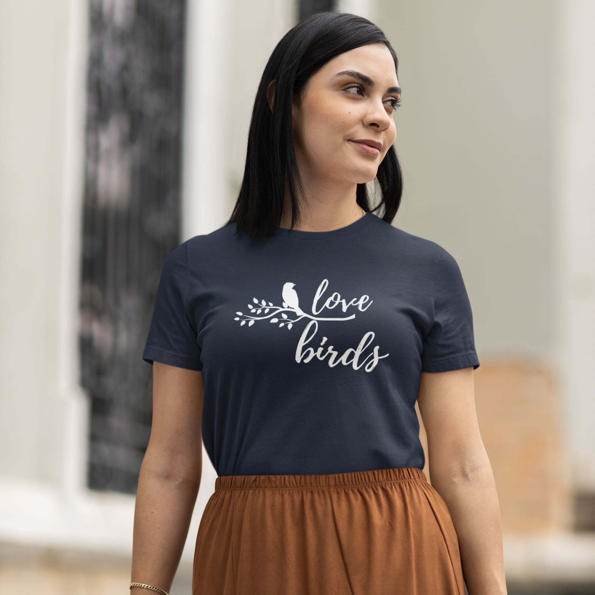 Navy blue women's birding t-shirt with the words Love birds and a graphic of a bird on a branch in white.