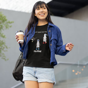 Black women's fit birder shirt with a red-footed, blue-footed and brown booby on it, but referencing only the scientific family name for the bird. Worn by a woman.