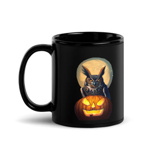 Black 11-ounce bird mug with a great horned owl sitting behind a jack-o-lantern with a full moon rising behind.