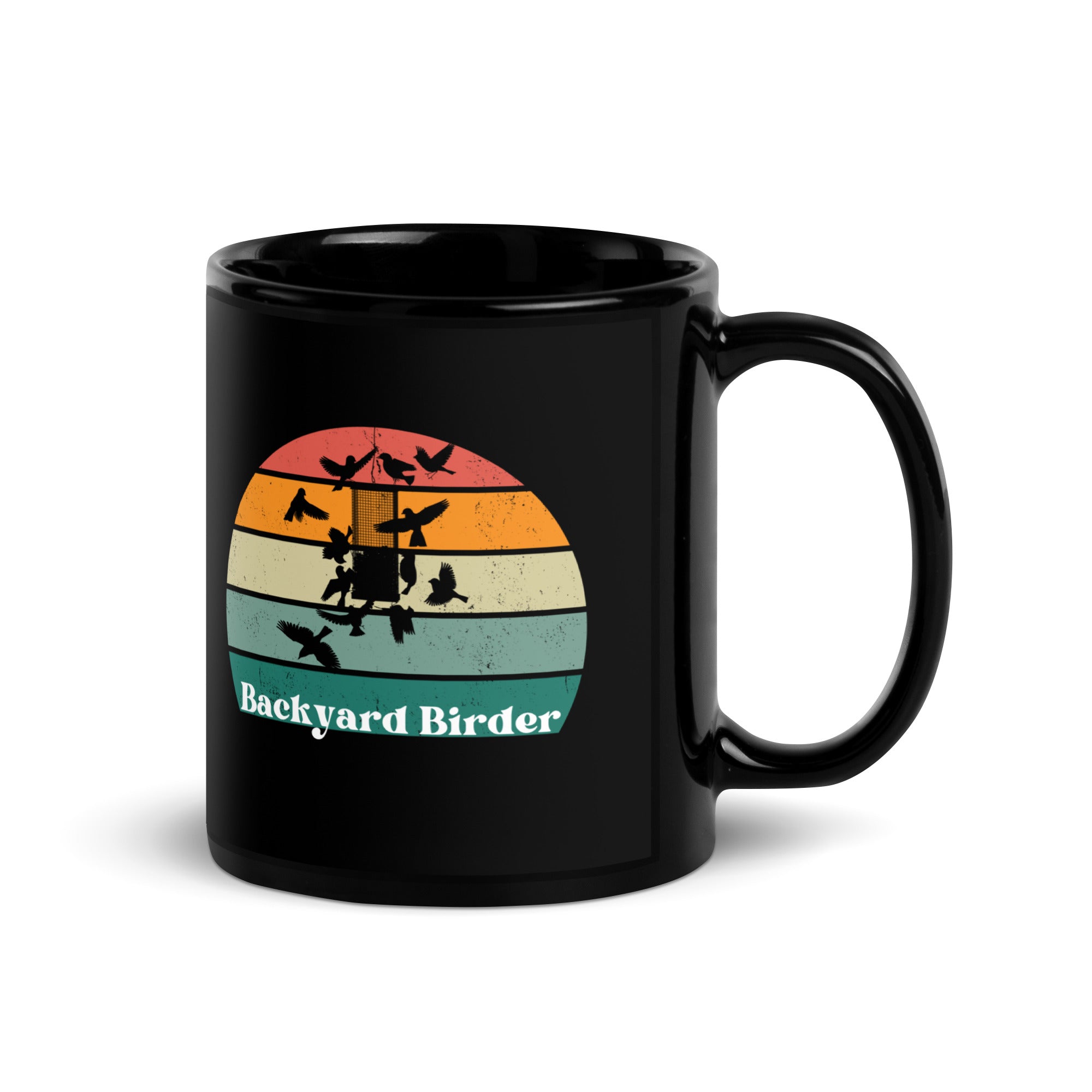 Black bird mug with a retro sun design outlining a bird feeder with the words Backyard Birder.