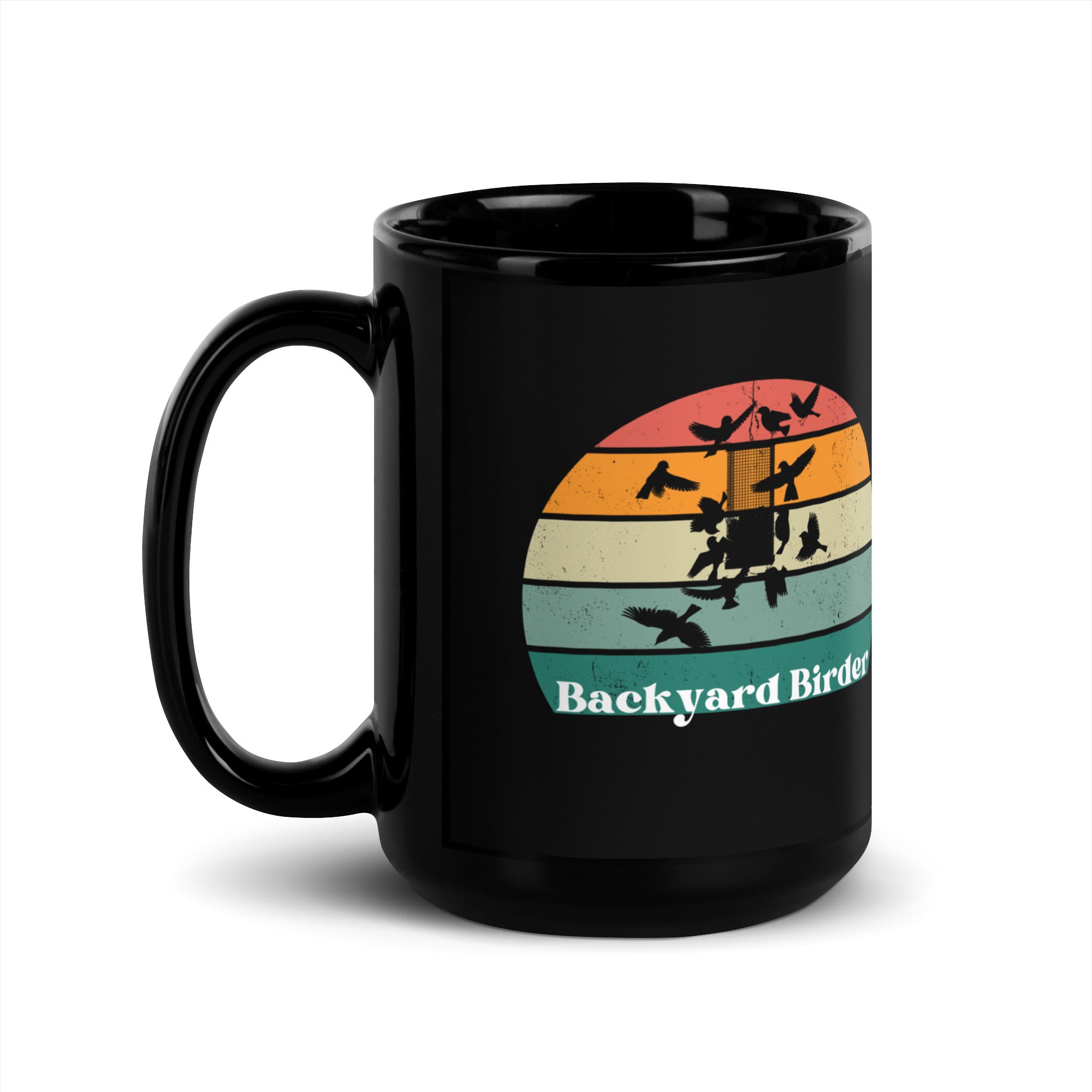 Black bird mug with a retro sun design outlining a bird feeder with the words Backyard Birder.