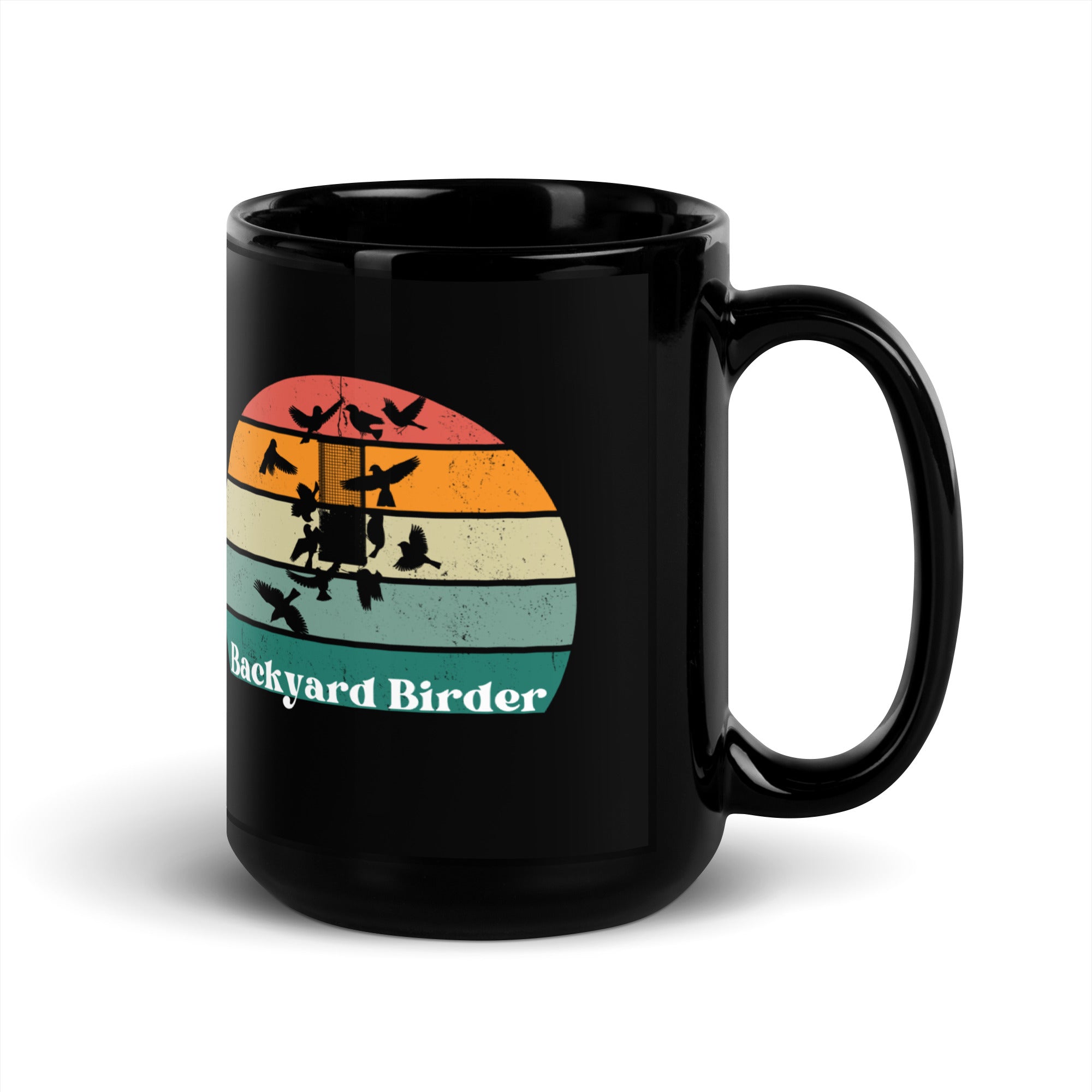 Black bird mug with a retro sun design outlining a bird feeder with the words Backyard Birder.