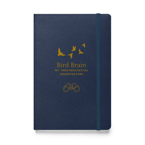 Hard bound journal in navy blue with the words, "Bird Brain, My Ornithological Observations" on the cover with a few flying birds above and a pair of binoculars below.