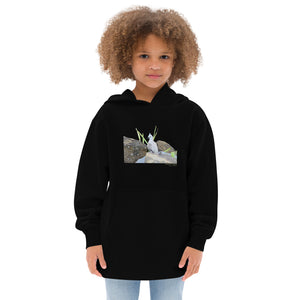 Black unisex youth bird hoodie with a graphic of a crested pigeon among some rocks and grass on front, and the words crested pigeon written below and the scientific name below that. Worn by a girl.