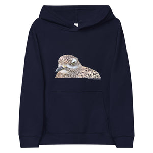 Navy unisex youth bird hoodie with an illustrated picture of a spotted thick-knee bird looking grumpy. The words spotted thick-knee are written below the illustration, including the scientific name.