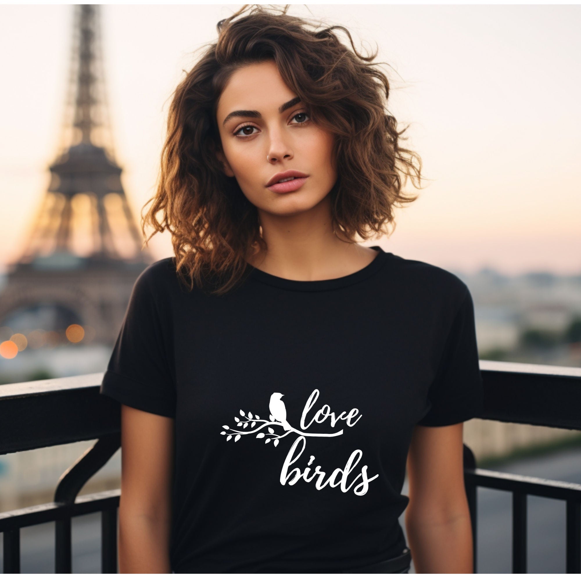 Black unisex birding t-shirt with the words Love birds and a graphic of a bird on a branch in white.