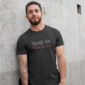 Dark grey unisex bird shirt with the words Nerdy for them birdies on the front in two coordinating fonts and colors. Worn by a man.