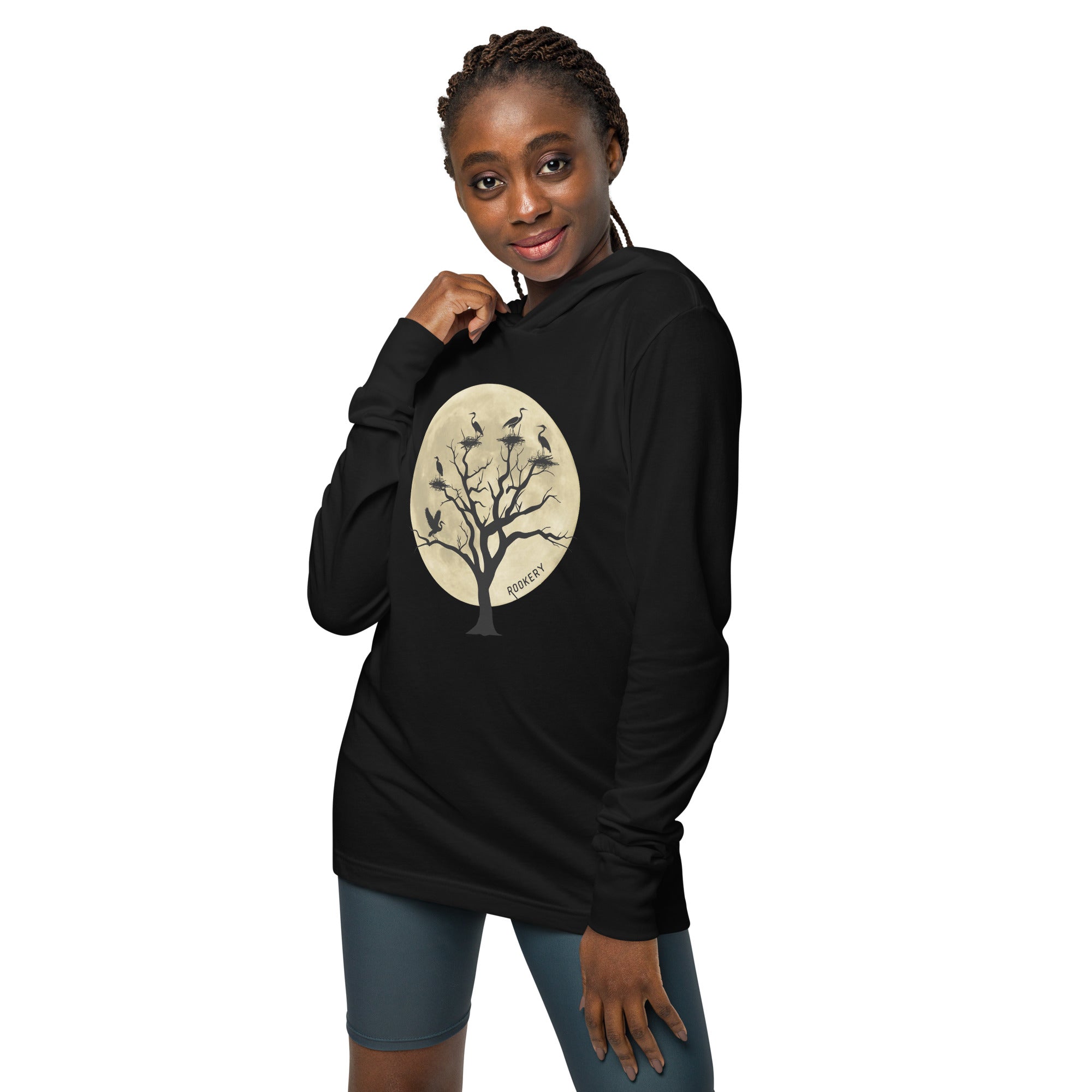 Black long-sleeved, hooded bird t-shirt with a full moon outlining a heron rookery.