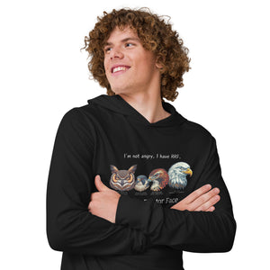 Black long-sleeved, hooded bird tee with illustrations of a Great Horned Owl, Peregrine, Red-Tailed Hawk and Bald Eagle and the words "I'm Not Angry, I have RRF. Resting Raptor Face" above and below the birds.  Worn by a man.