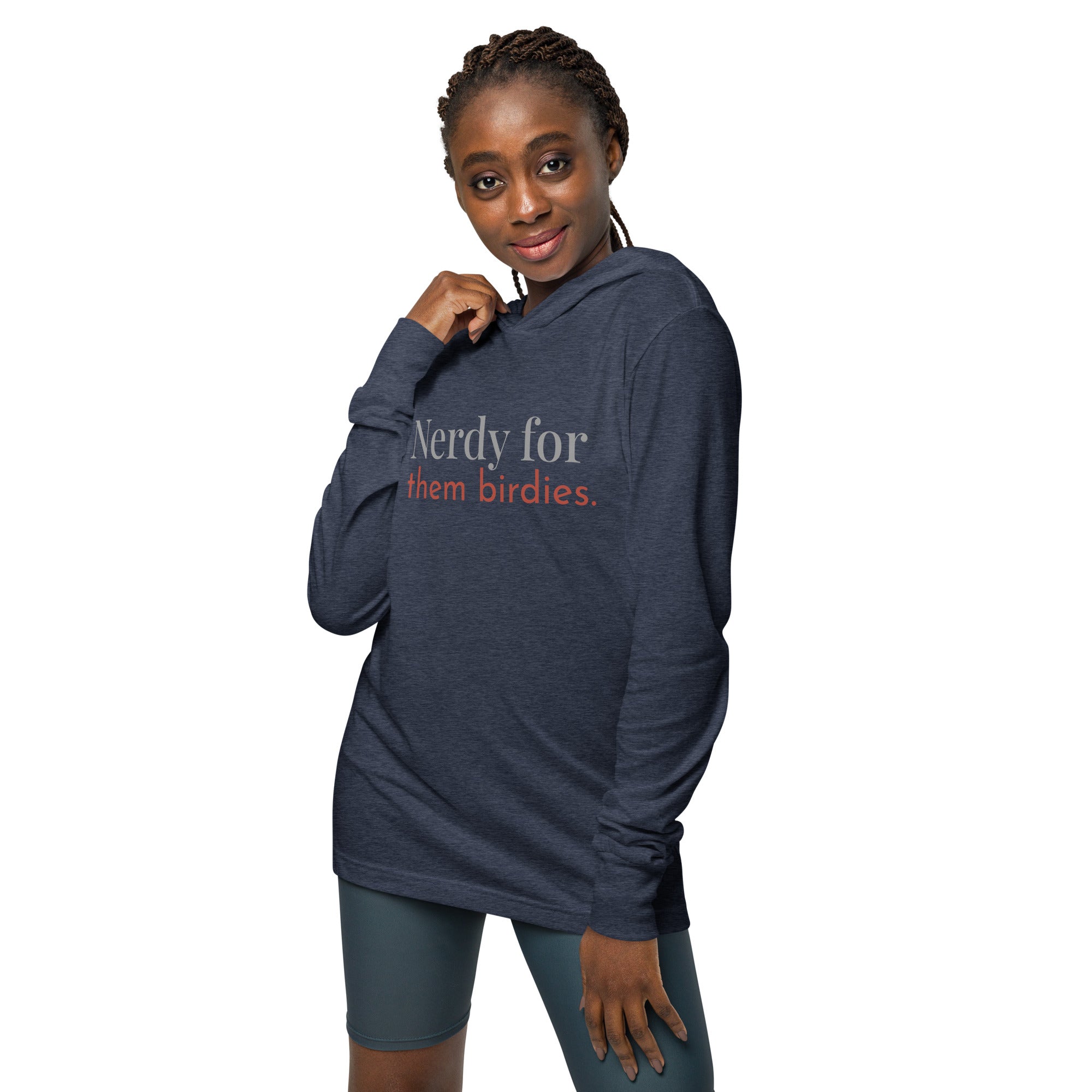 Heather navy blue, hooded, long-sleeved t-shirt with the words Nerdy for them birdies on the front in coordinating colors. Worn by a woman.