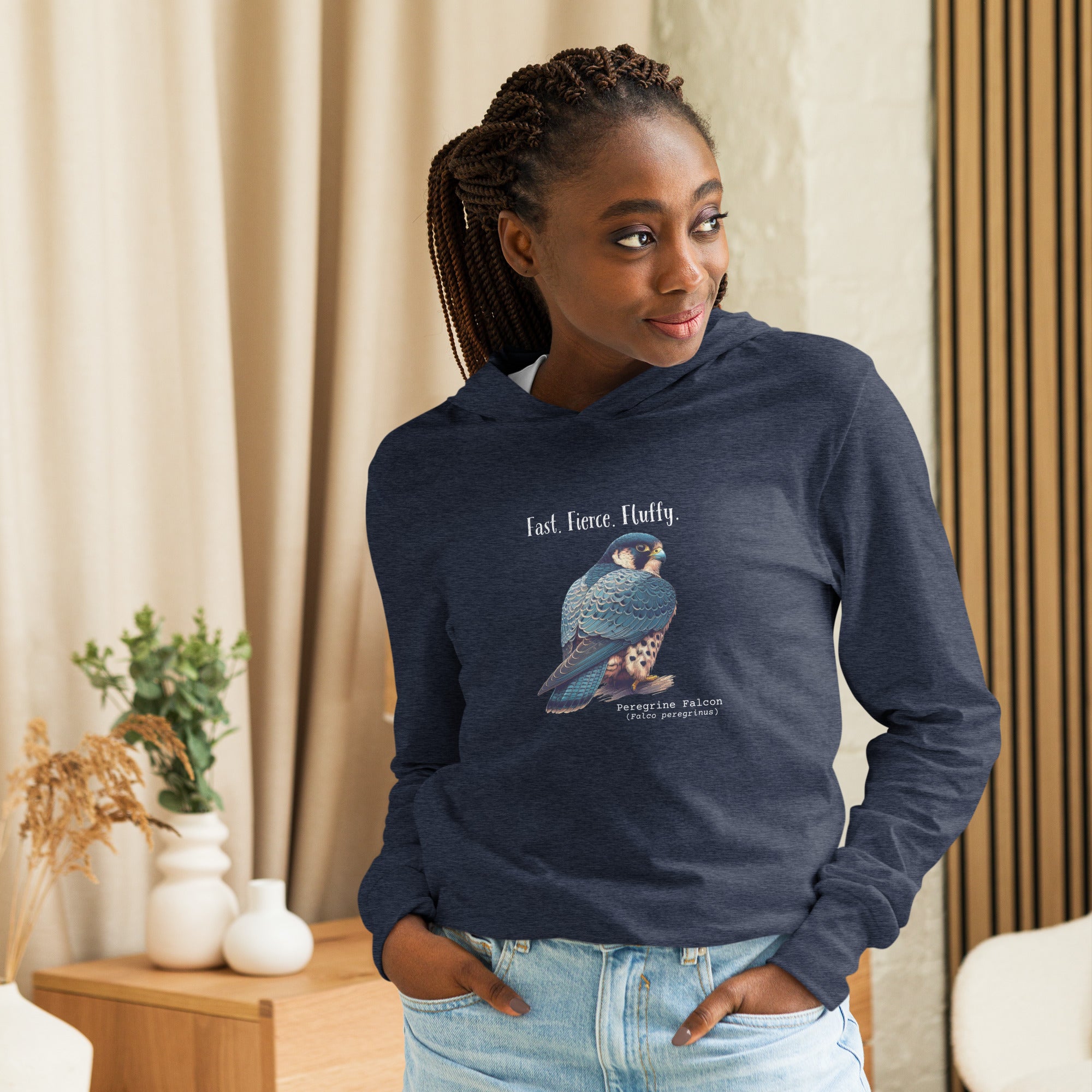 Navy heather, long-sleeve, hooded bird t-shirt with a peregrine falcon under the words, Fast, Fierce, Fluffy. Worn by a woman.