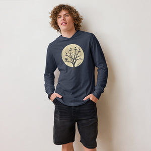 Navy heather, long-sleeve, hooded bird t-shirt with a full moon outlining a heron rookery. Worn by a man.