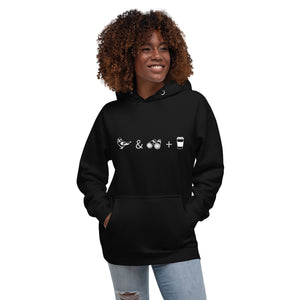 Unisex black hooded bird sweatshirt celebrating bird watching and coffee with a graphic of binoculars, a bird, and a travel cup of coffee. Worn by a woman.