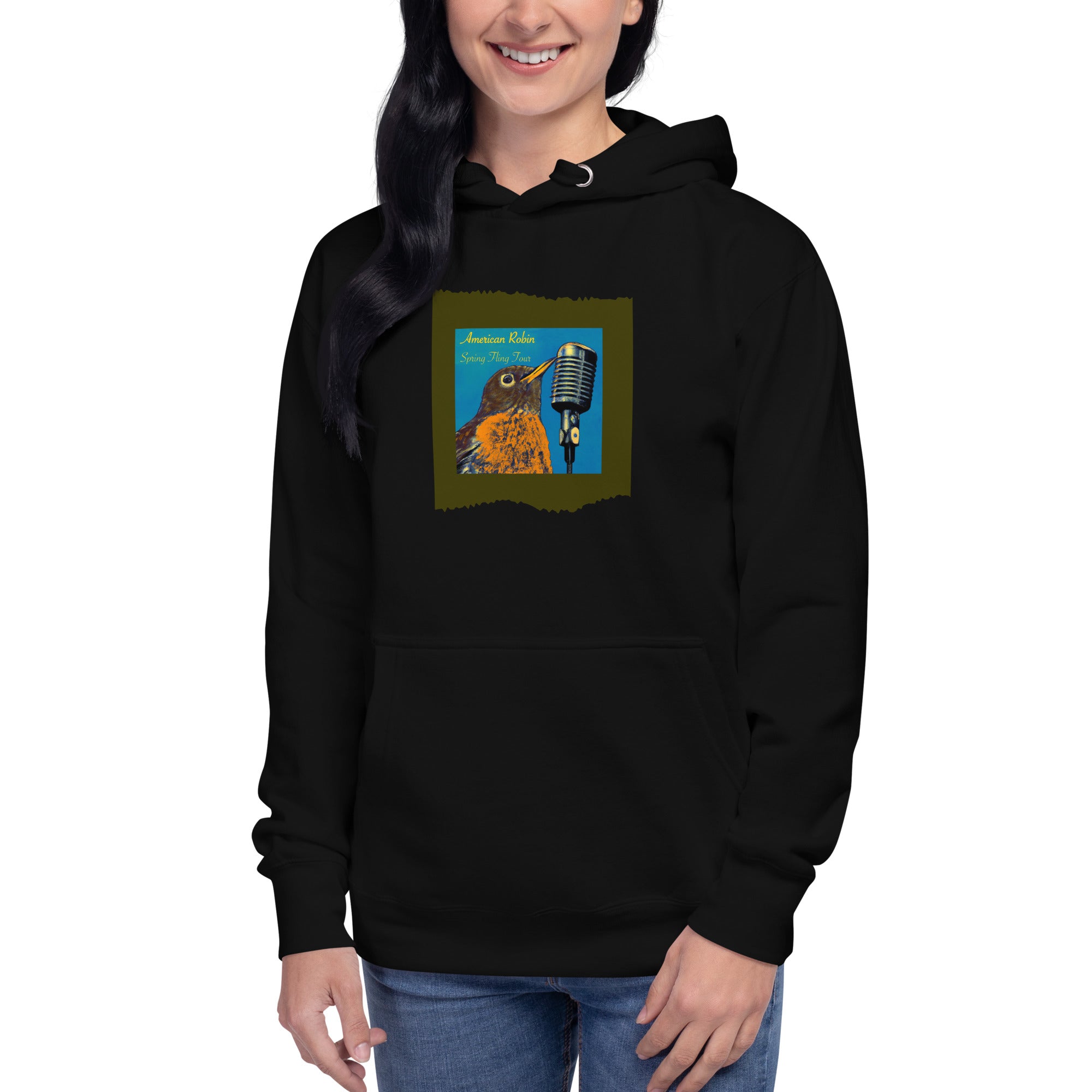 Black unisex bird hoodie featuring an illustration of an American Robin and a microphone and the words American Robin, Spring Fling Tour. Worn by a woman.