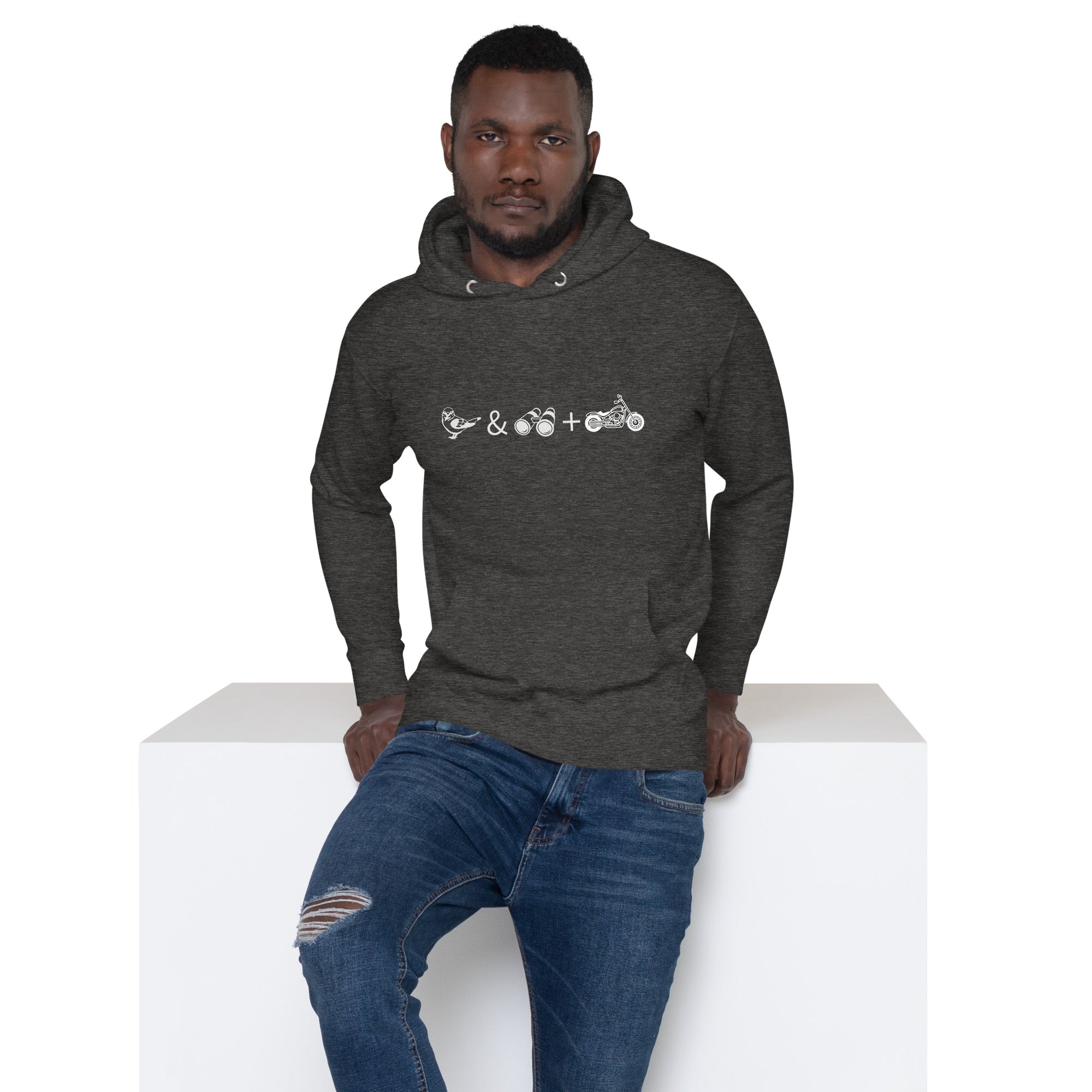 Unisex dark heather grey birding hoodie celebrating bird watching and motorcycling with a graphic of binoculars, a bird, and a motorcycle. Worn by a man.