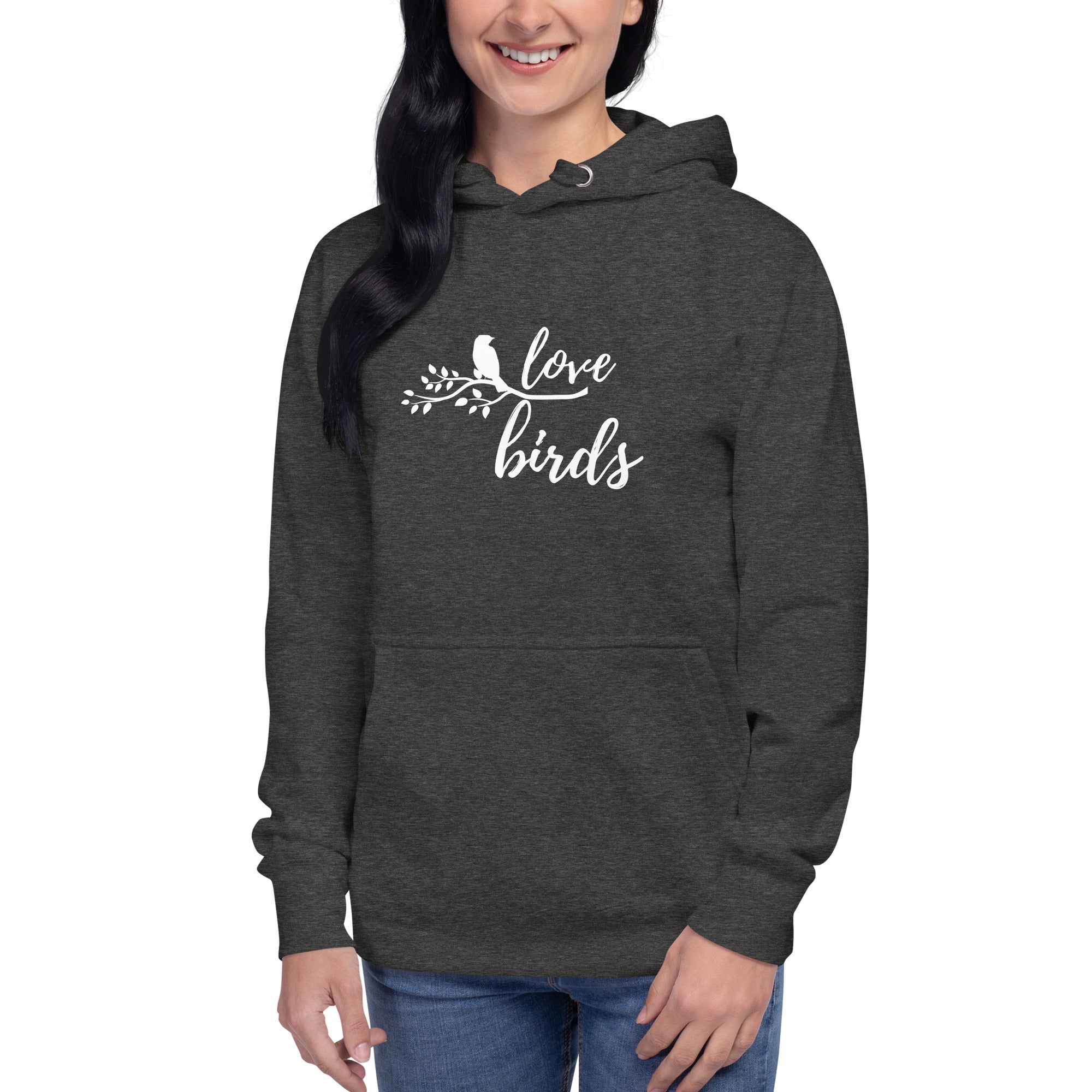 Dark heather gray unisex bird hoodie with "love birds" on the front and a bird sitting on a branch. Worn by a woman.