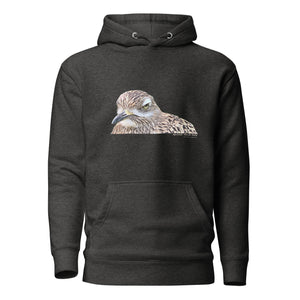 Dark gray unisex bird hoodie with an illustrated picture of a spotted thick-knee bird looking grumpy. The words spotted thick-knee are written below the illustration, including the scientific name.