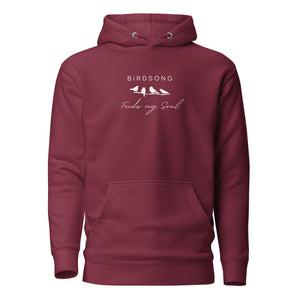 Maroon hoodie with the words Birdsong feeds my should above and below a white graphic of 4 birds on a branch.