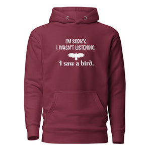 Maroon unisex bird hoodie with the words I'm sorry I wasn't listening, I saw a bird. And a graphic of a bird flying.