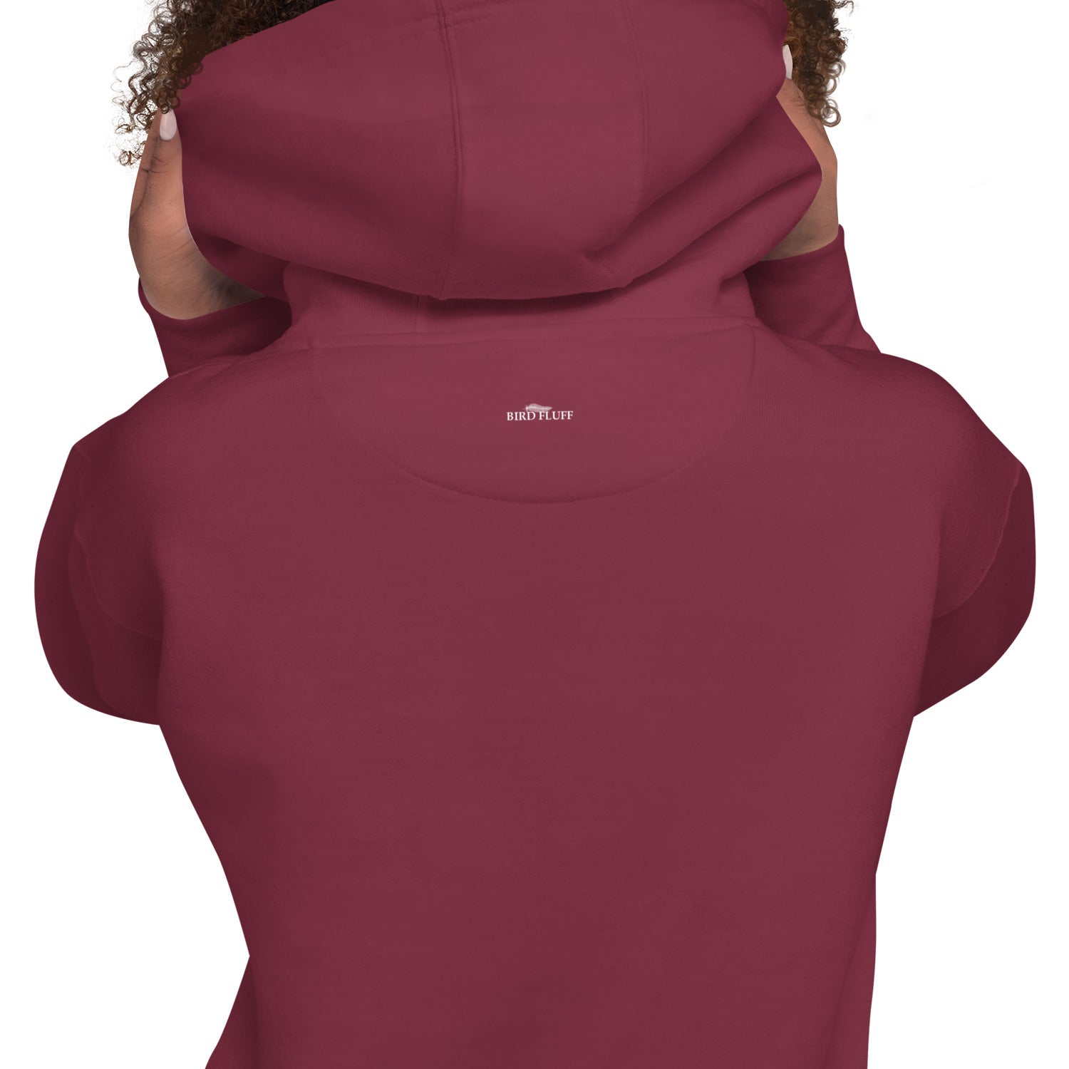 Maroon unisex hoodie with a budgie in a santa hat surrounded by the words Merry Tweetmas, separated by to seed sprigs. Rear view of hoodie, with brand logo beneath hood at collar.