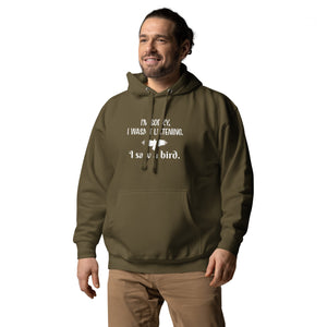 Army green unisex bird hoodie with the words I'm sorry I wasn't listening, I saw a bird. And a graphic of a bird flying. Worn by a man.