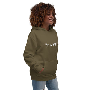 Unisex military green birding hoodie celebrating bird watching and overlanding with a graphic of binoculars, a bird, and an overlanding vehicle. Worn by a woman.