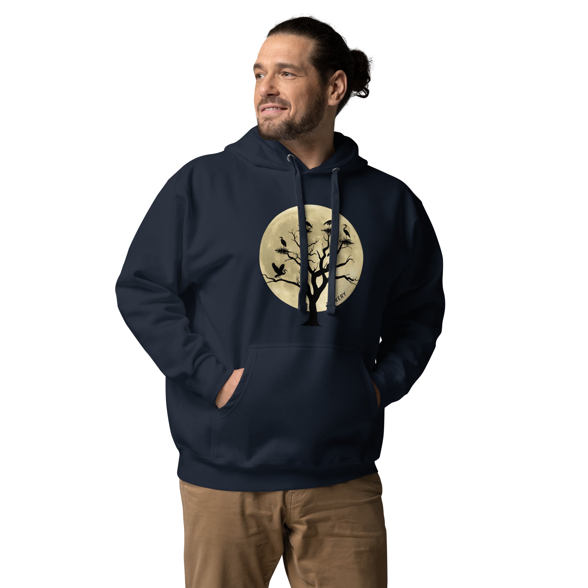 Navy blue bird hoodie with a full moon outlining a heron rookery. Worn by a man.