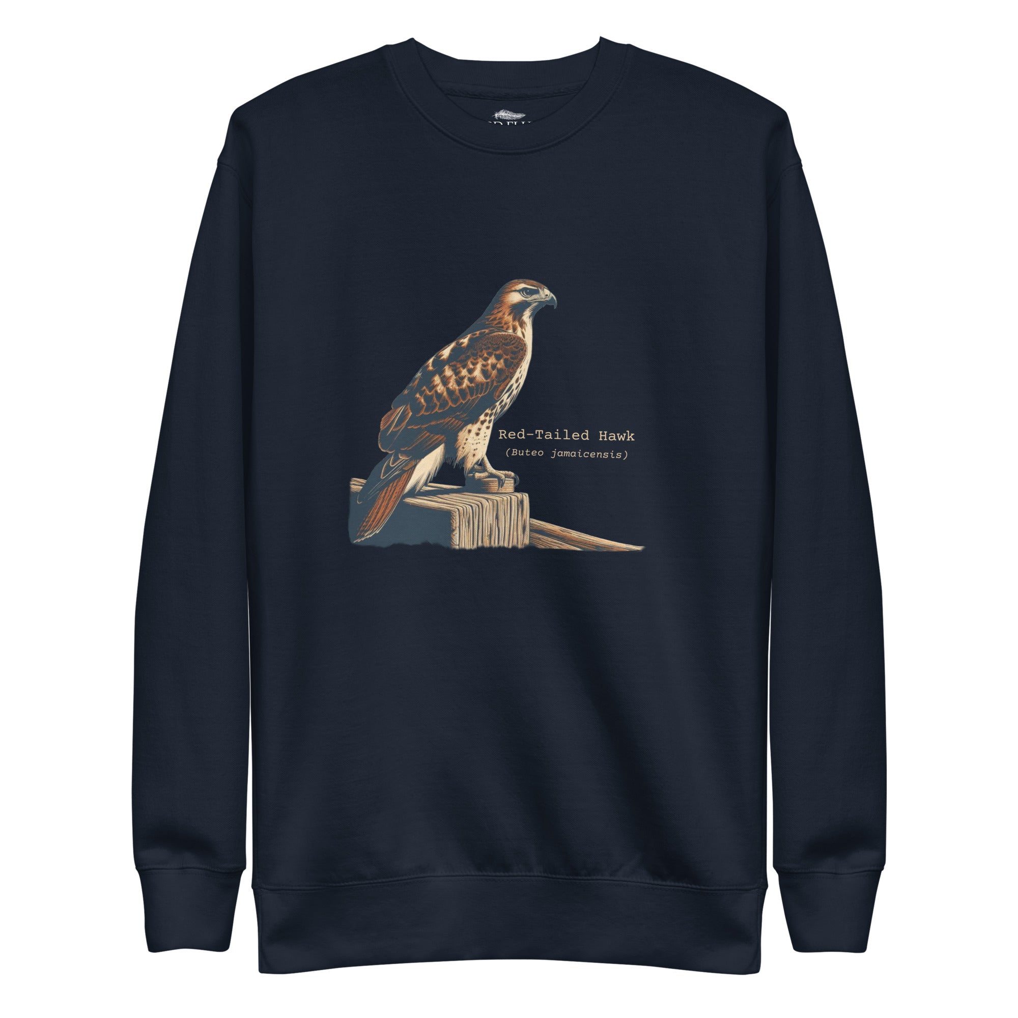 Navy birding sweatshirt with an artistic depiction of a red-tailed hawk sitting on a fence and the common and scientific names for the bird next to it.