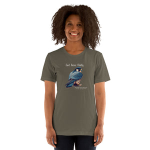 An army green bird shirt with the words, "Fast. Fierce. Fluffy" above an illustration of a peregrine falcon.  Worn by a woman.