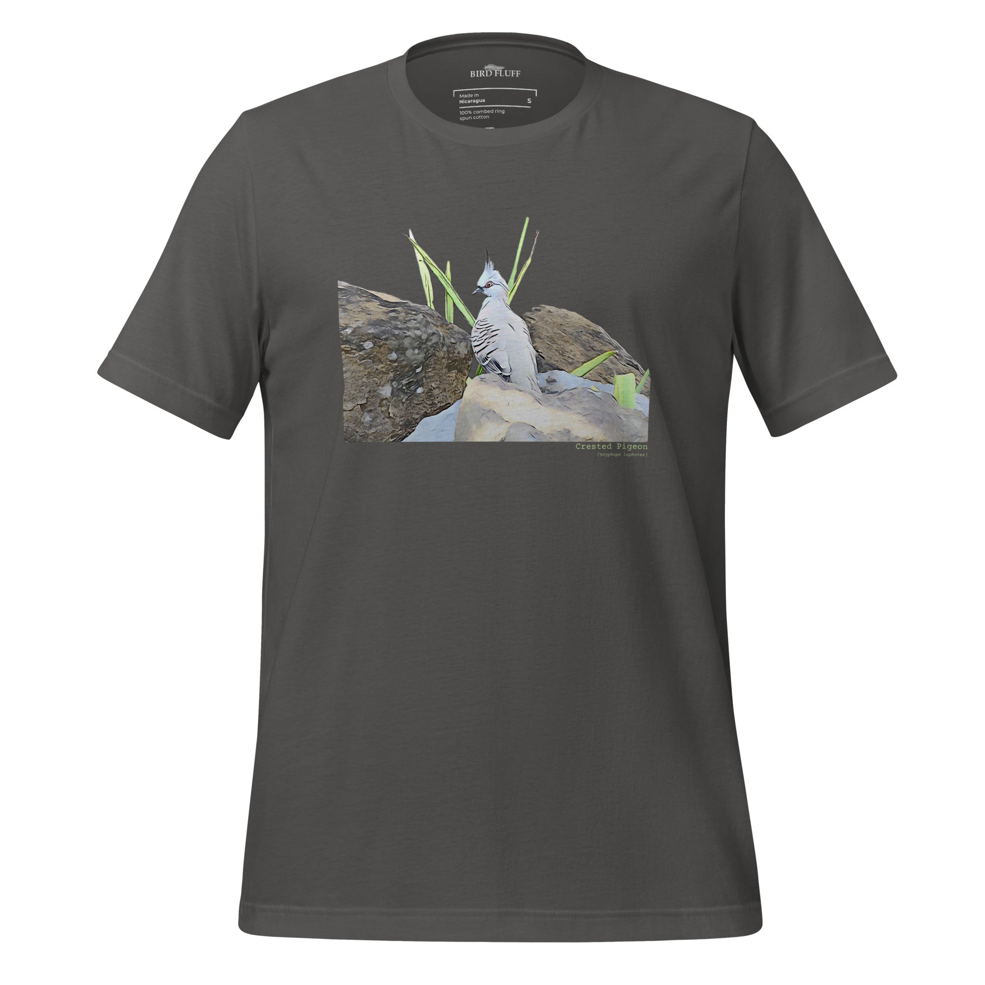 Dark gray unisex bird t-shirt with a graphic of a crested pigeon among some rocks and grass on front, and the words crested pigeon written below and the scientific name below that.