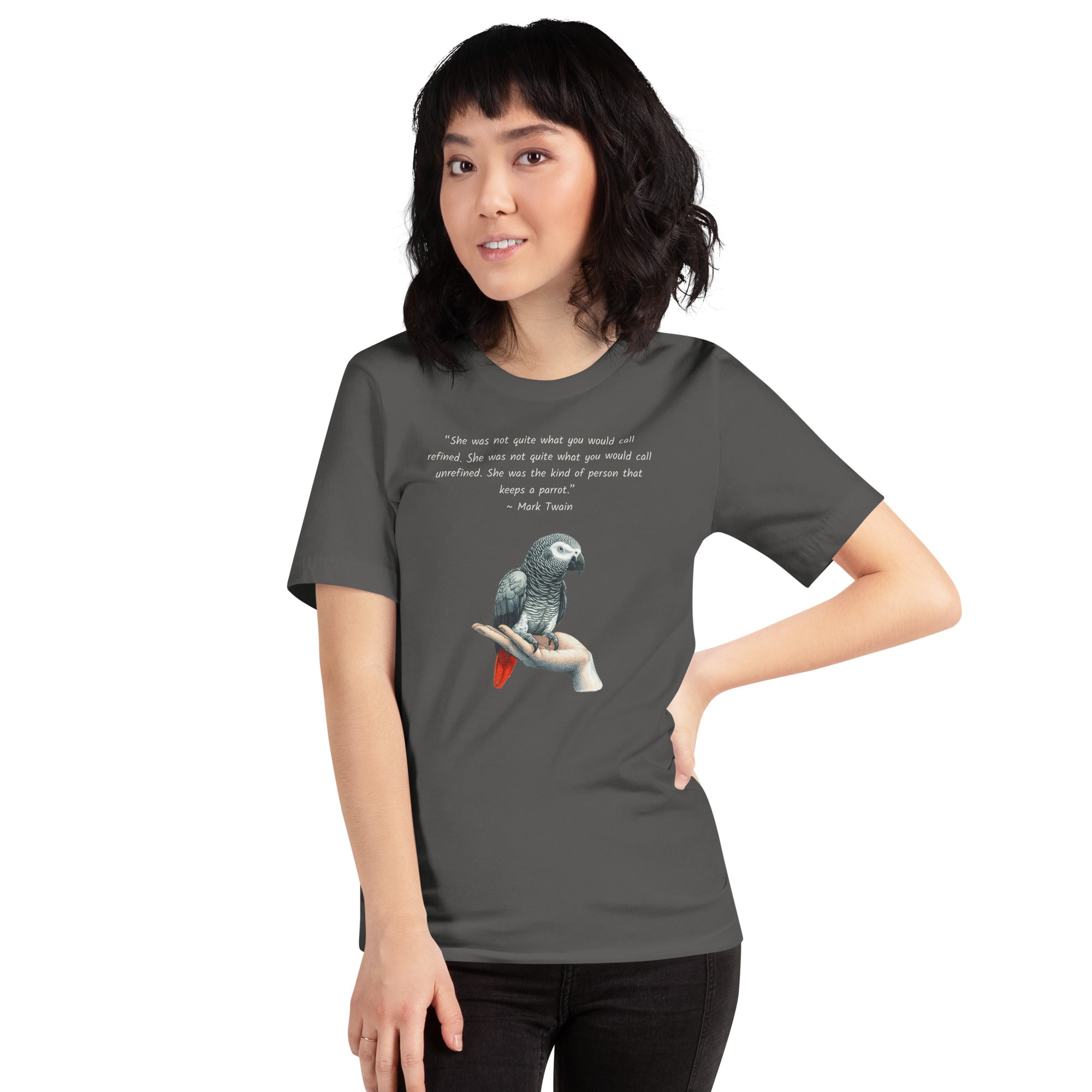 Navy bird shirt with a Mark Twain woman who keeps parrot quote and a illustration of an african grey parrot perched on a hand beneath.