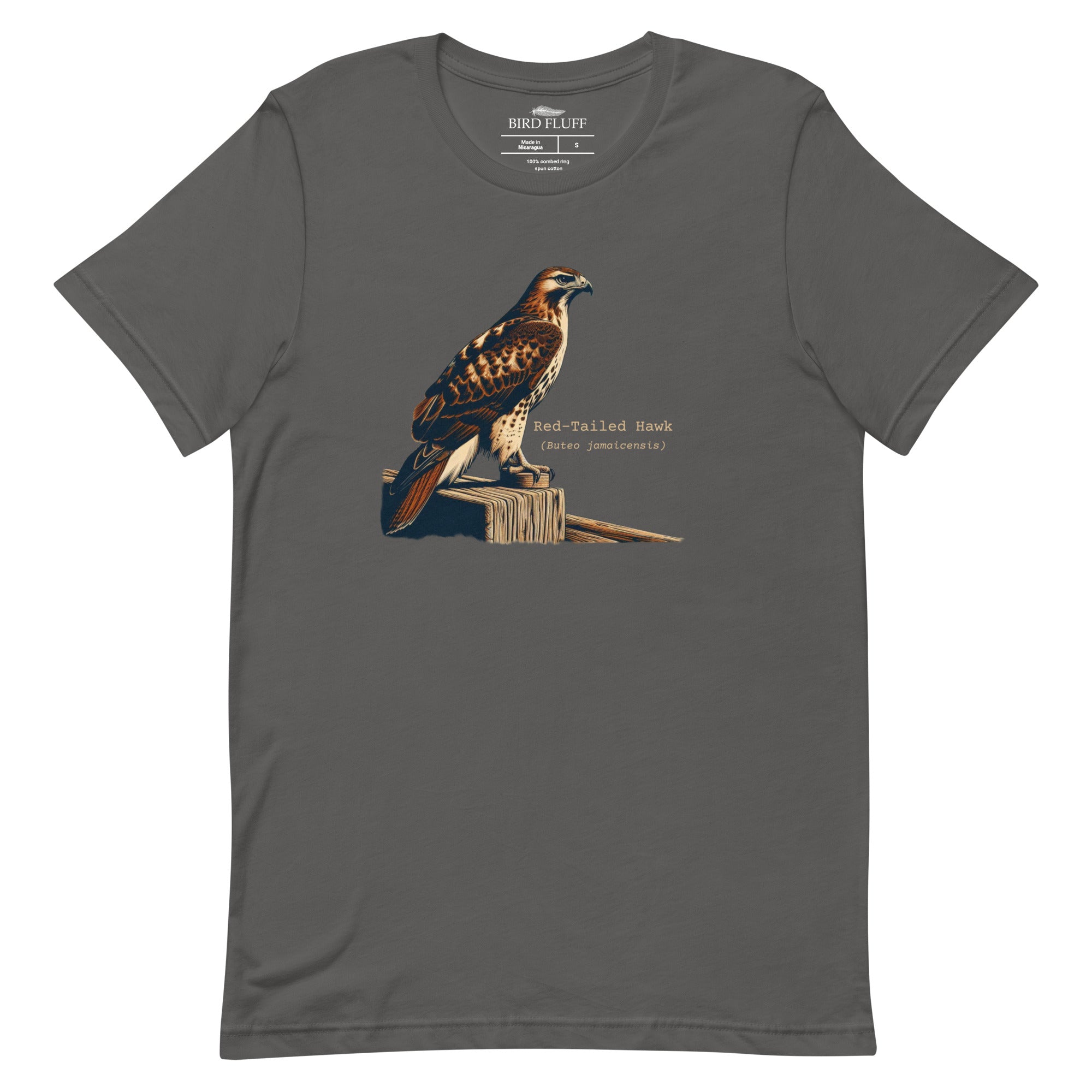 Gray bird shirt with an artistic depiction of a red-tailed hawk sitting on a fence and the common and scientific names for the bird next to it.