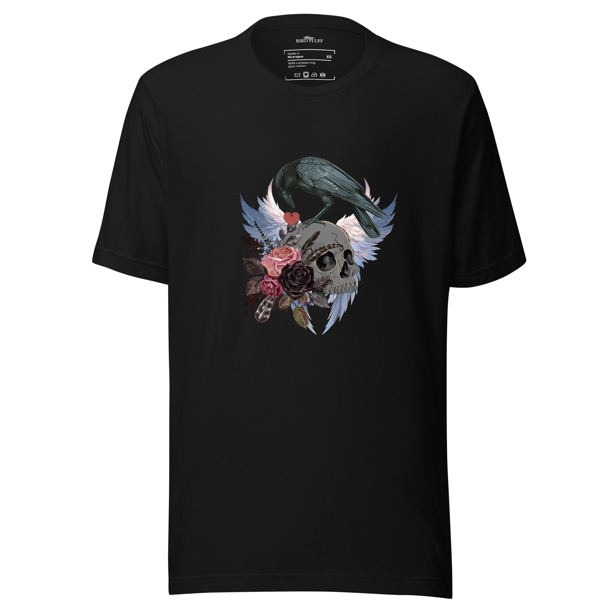 Gothic themed black bird shirt with a crow carrying a heart pendant, perched on a skull surrounded by flowers, feathers and wings.