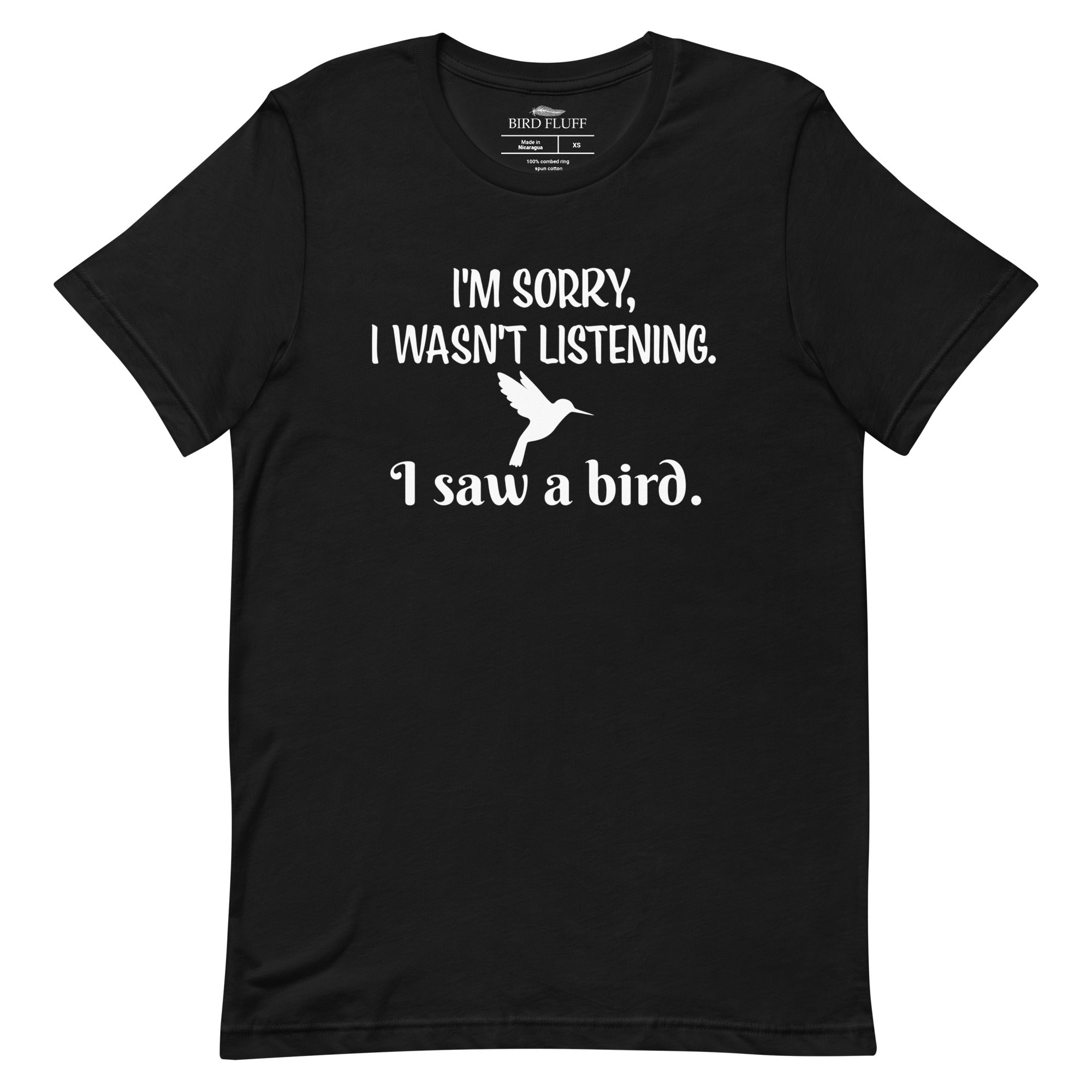 Black bird t-shirt with the words I'm sorry I wasn't listening, I saw a bird. And a graphic of a hummingbird flying. 