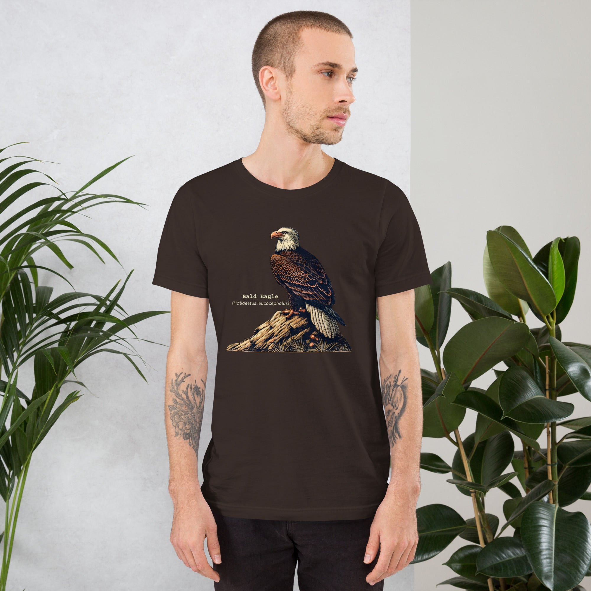 Army green unisex bird shirt with a Bald Eagle perched on a rock, next to its common and scientific names.