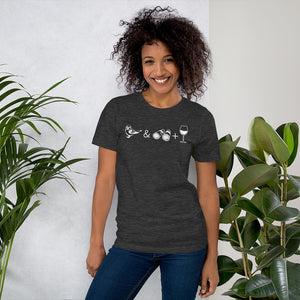 Unisex dark heather grey bird t-shirt celebrating bird watching and wine drinking with a graphic of binoculars, a bird, and a glass of wine. Worn by a woman.