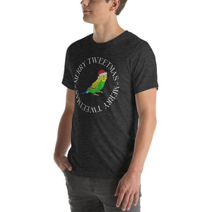 Dark heather grey unisex bird t-shirt with a budgie in a santa hat surrounded by the words Merry Tweetmas, separated by to seed sprigs. Worn by a man.