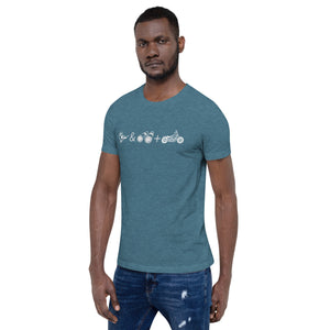 Unisex light blue bird t-shirt celebrating bird watching and motorcycling with a graphic of binoculars, a bird, and a motorcycle. Worn by a man.