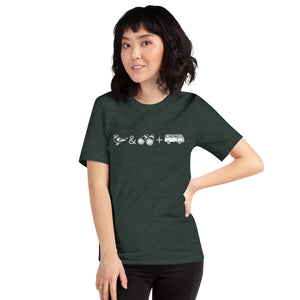 Forest Green unisex bird t-shirt with graphics of binoculars, birds and a van. Worn by a woman.