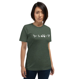 Unisex forest green heather bird t-shirt celebrating bird watching and overlanding with a graphic of binoculars, a bird, and an overlanding vehicle. Worn by a woman.