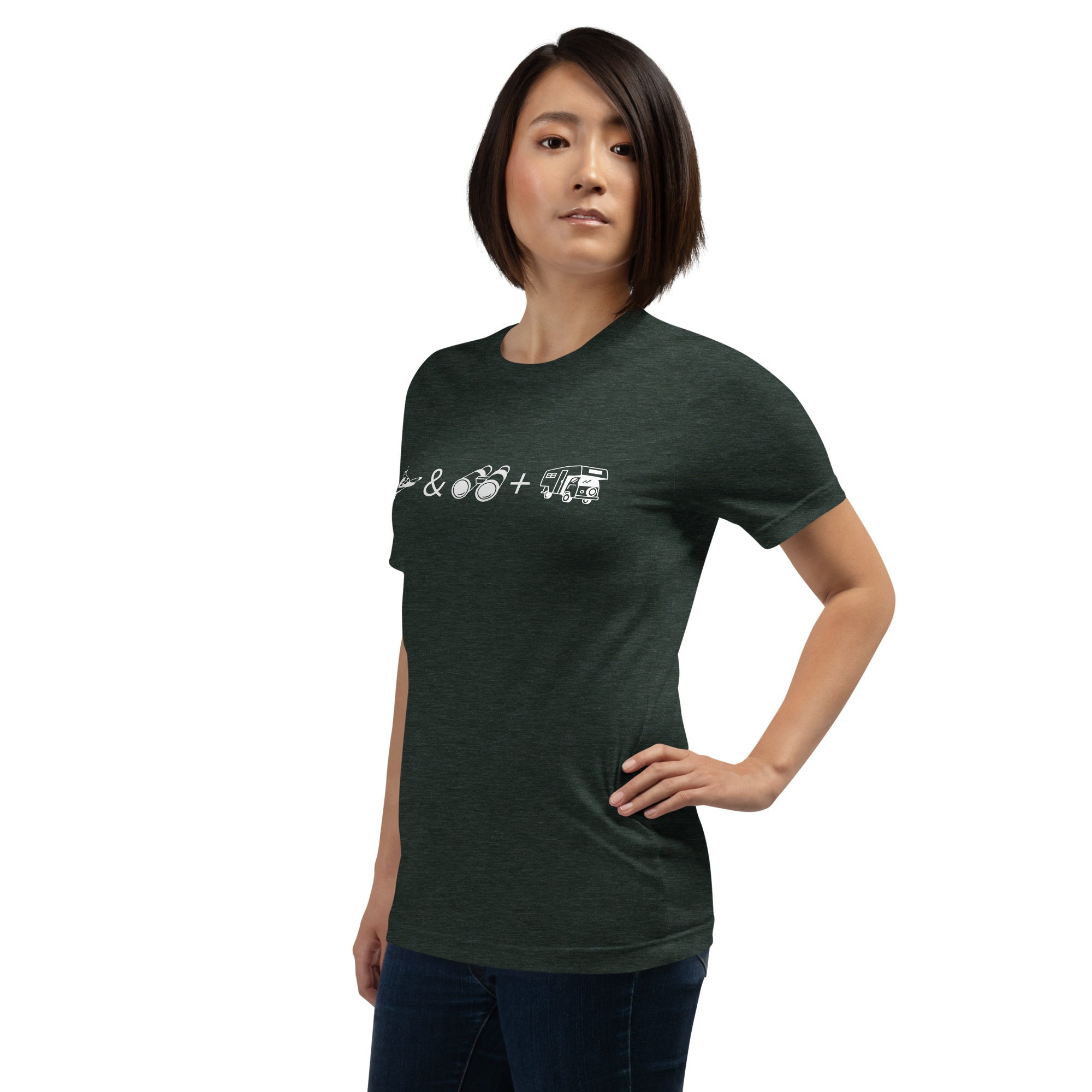 Unisex forest green heather bird t-shirt celebrating bird watching and overlanding with a graphic of binoculars, a bird, and an overlanding vehicle. Worn by a woman.