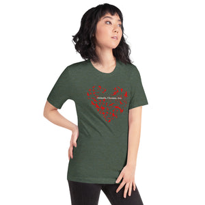 Heather forest green unisex bird t-shirt with a bird silhouettes of many different types of birds in red and arranged so they make a heart shape, on top of that the words, "Animalia, Chordata, Aves". Worn by a woman.