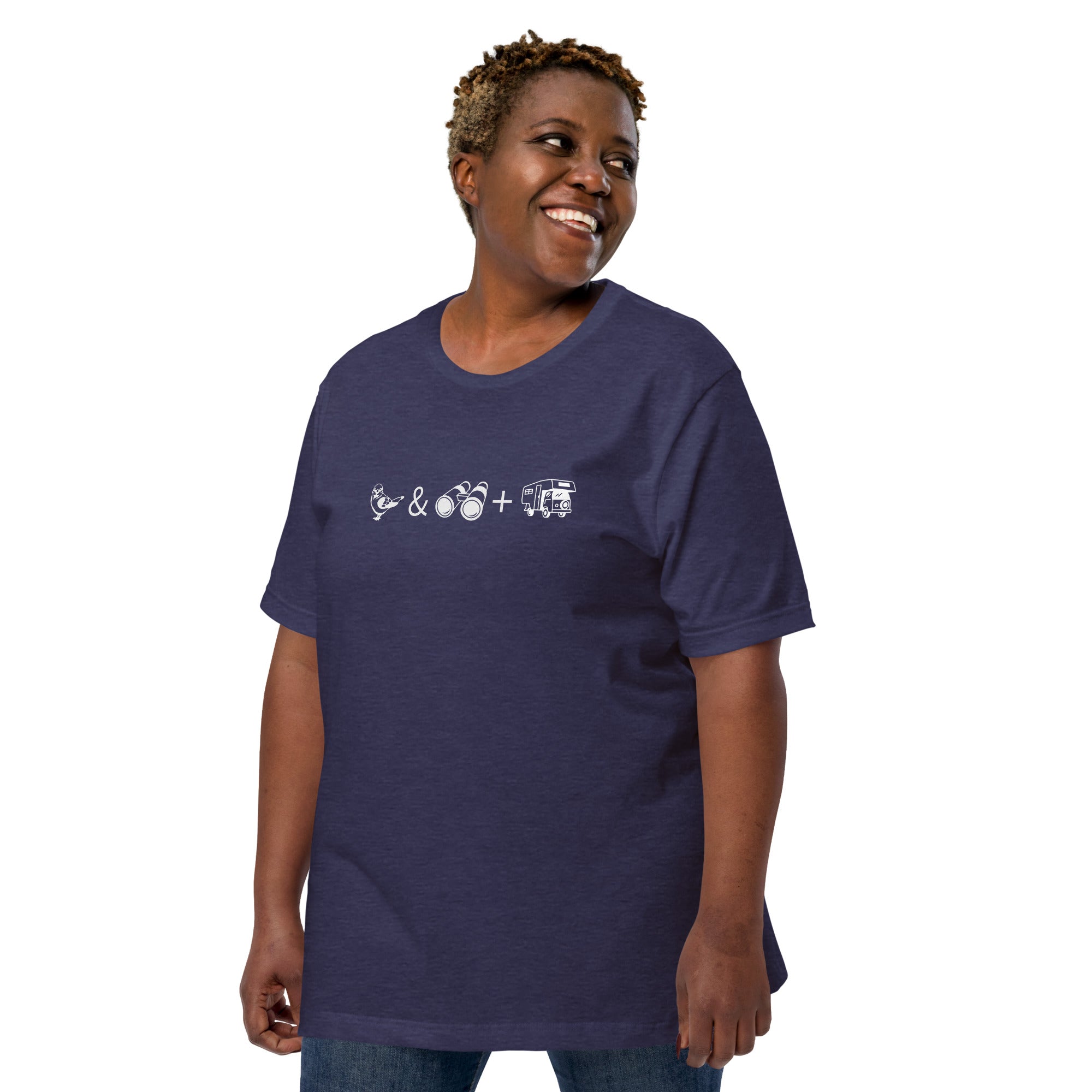 Unisex navy bird t-shirt celebrating bird watching and overlanding with a graphic of binoculars, a bird, and an overlanding vehicle. Worn by a woman.