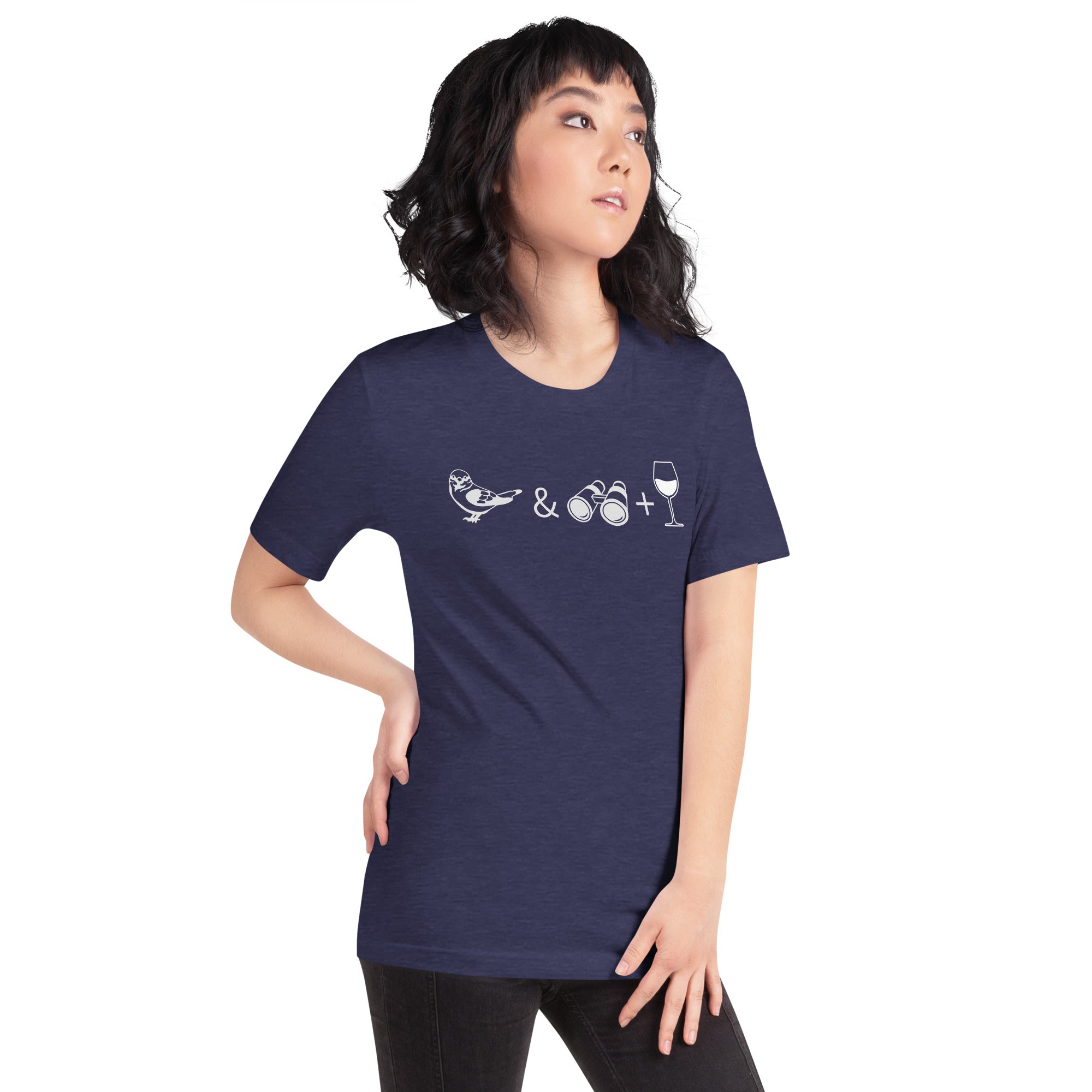 Unisex dark heather blue bird t-shirt celebrating bird watching and wine drinking with a graphic of binoculars, a bird, and a glass of wine. Worn by a woman.