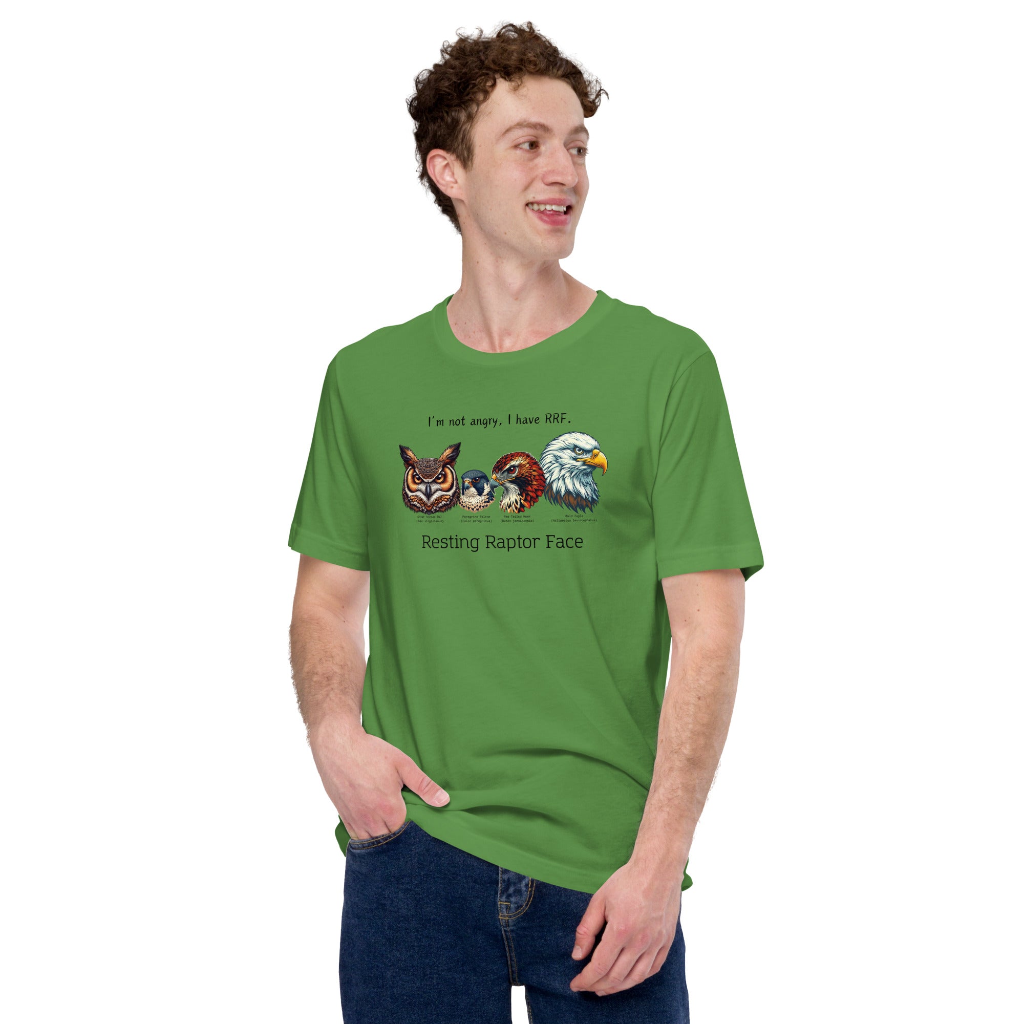 A man wearing a green bird shirt with a great horned owl, a peregrine falcon, a red-tailed hawk and a bald eagle. The shirt has text that says, I'm not angry, I have RRF. Resting Raptor Face.