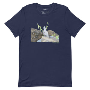 Navy blue unisex bird t-shirt with a graphic of a crested pigeon among some rocks and grass on front, and the words crested pigeon written below and the scientific name below that.