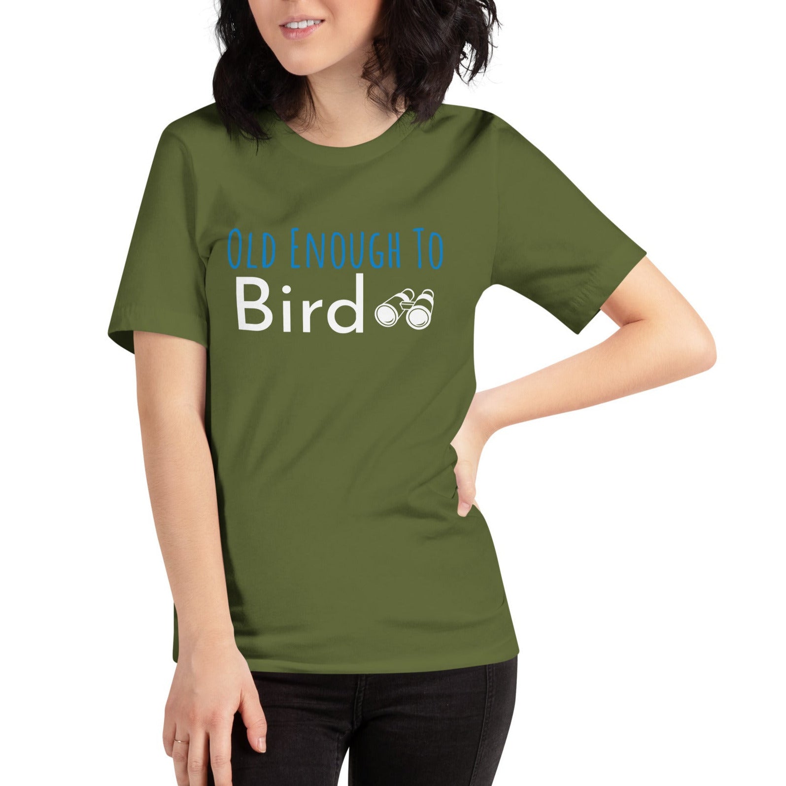 Olive green bird shirt with the words, "Old Enough To Bird" and a pair of binoculars on the front. Worn by a woman.