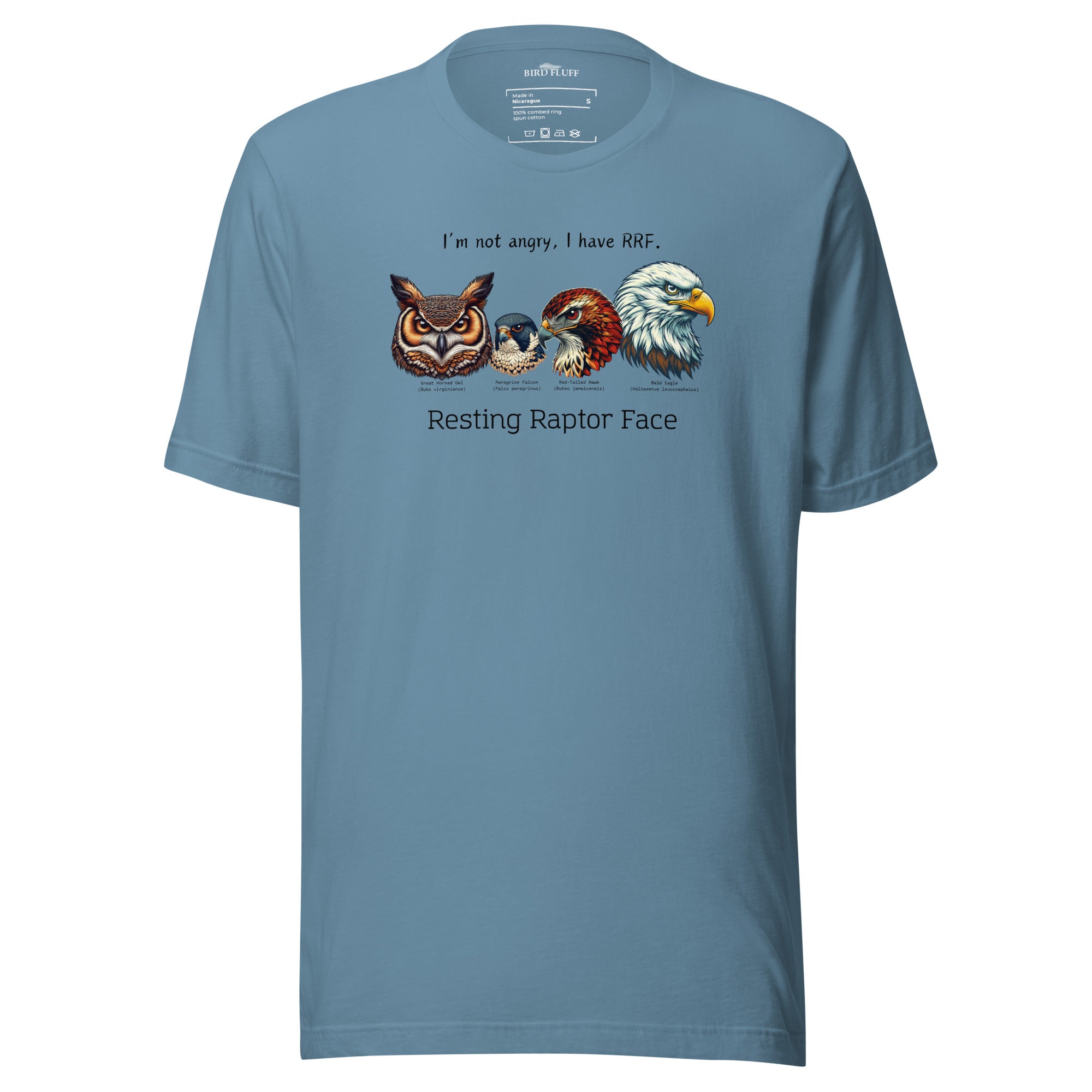 A steel blue bird shirt with a great horned owl, a peregrine falcon, a red-tailed hawk and a bald eagle. The shirt has text that says, I'm not angry, I have RRF. Resting Raptor Face.