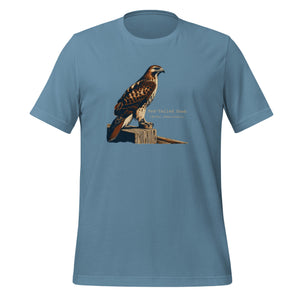 Steel blue bird shirt with an artistic depiction of a red-tailed hawk sitting on a fence and the common and scientific names for the bird next to it.